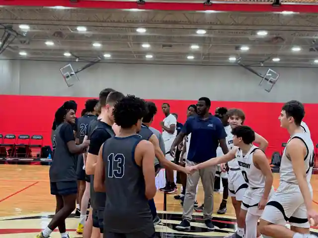 Players from two teams shaking hands on the court at the 2023 Tampa Bay Sportsmanship Classic